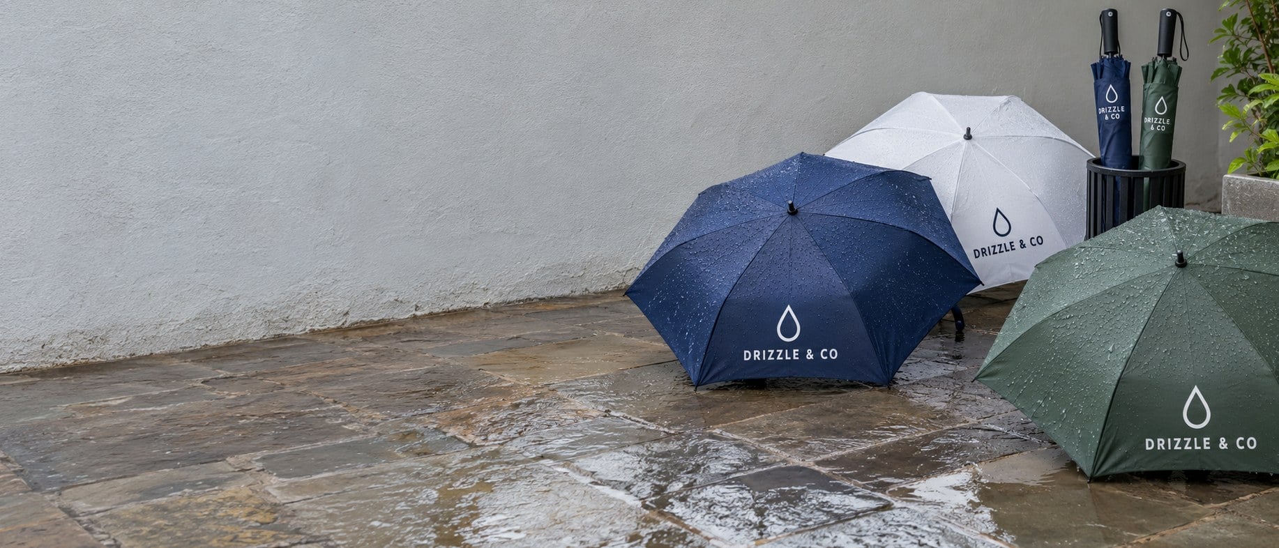 Custom printed logo umbrellas open in a row on a patio